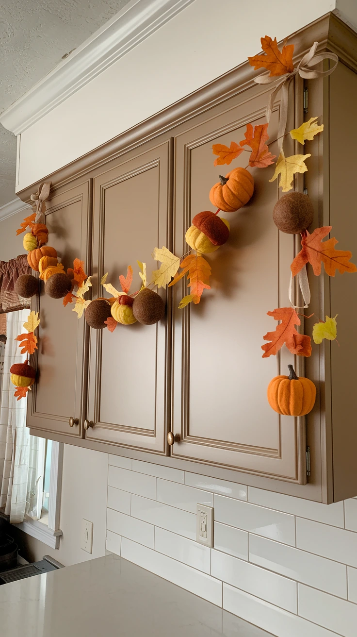 Homemade fall garland, strung leaves, mini pumpkins, felt acorns, crafty decor, personalized touch