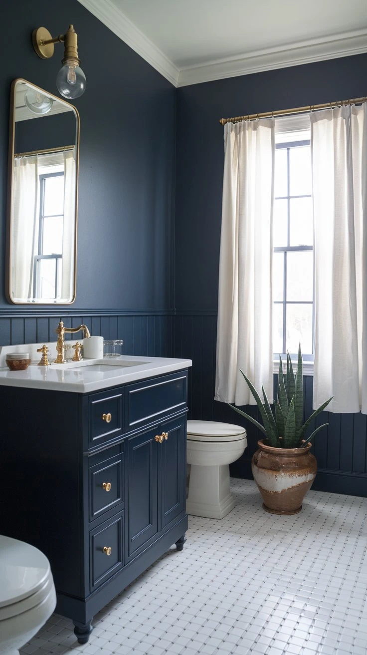 Elegant navy bathroom, sophisticated design, dark blue walls, white accents, gold fixtures, luxurious feel, classic style, bold color choice, dramatic atmosphere, high-contrast look