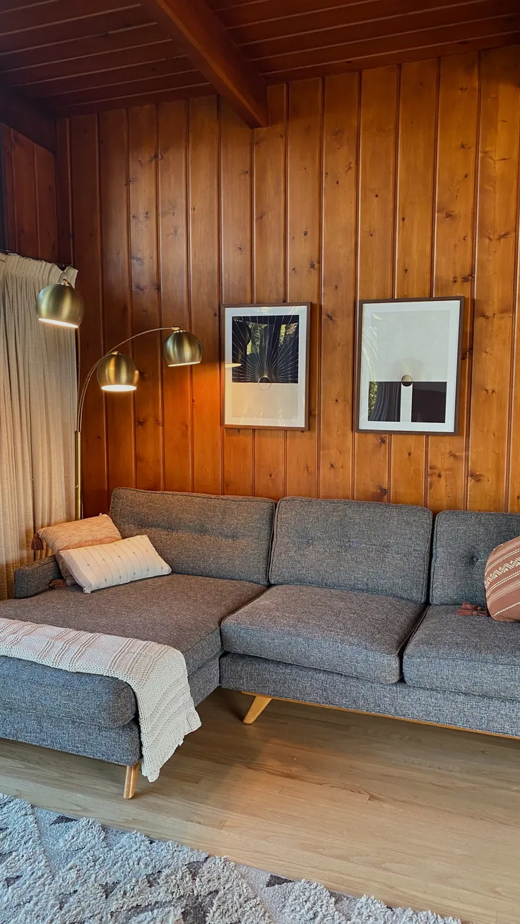 mid century modern,home,couch,sofa,lamp,posters,artwork,modern,interior design,wood,cabin